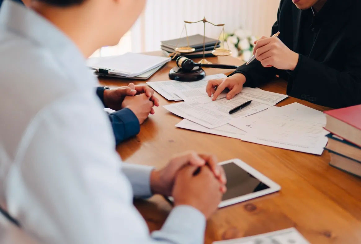 People discussing paperwork